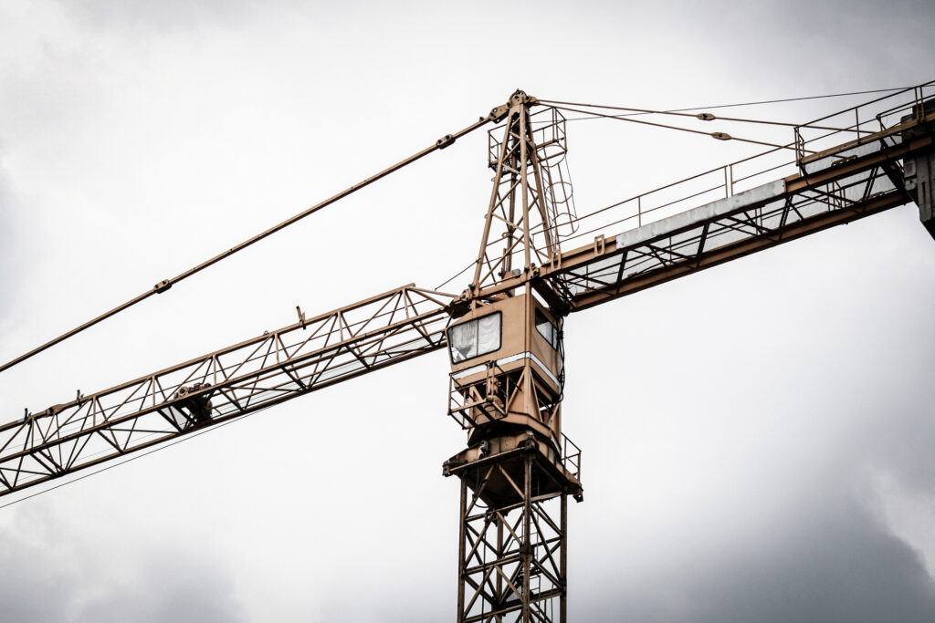 Crane against cloudy sky